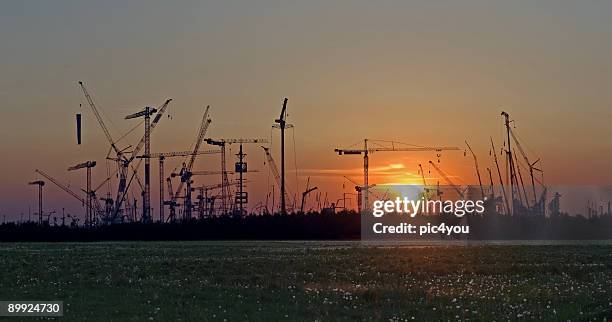 cranes - silhouette münchen stock pictures, royalty-free photos & images