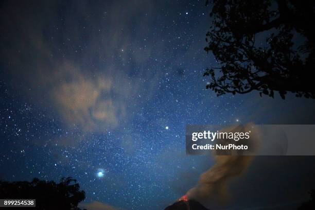 Sinabung Mountain scatters volcanic material and hot lava from its crater as seen from Tiga kicat, North Sumatra, Indonesia, on Thursday, December...