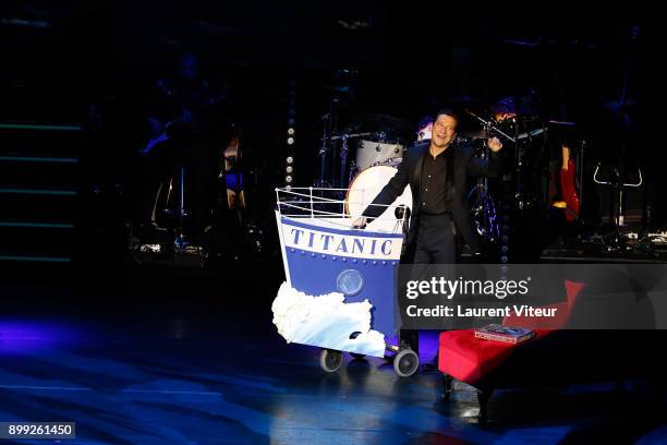 Laurent Gerra imitates Singer Celine Dion during "Laurent Gerra Sans Moderation" at L'Olympia on December 27, 2017 in Paris, France.