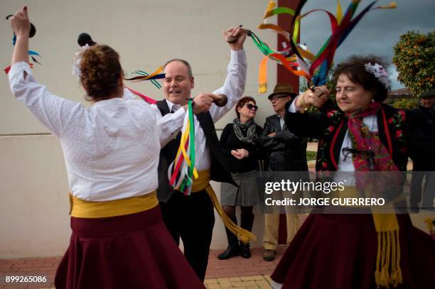 Dancers in traditional costumes perform with castanets during a rehearsal before a traditional Verdiales Flamenco contest in Malaga on December 28,...