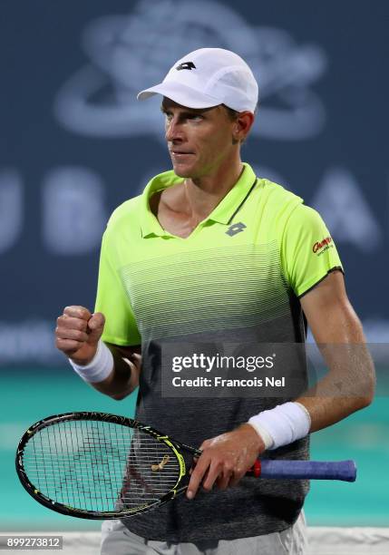 Kevin Anderson of South Africa celebrates a point against Pablo Carreno Busta of Spain during his men's singles match on day one of the Mubadala...