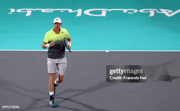 Kevin Anderson of South Africa celebrates a point against Pablo Carreno Busta of Spain during his men's singles match on day one of the Mubadala...