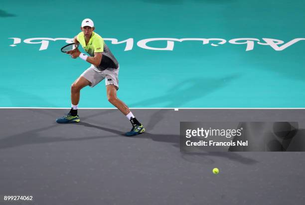 Kevin Anderson of South Africa plays a forehand against Pablo Carreno Busta of Spain during his men's singles match on day one of the Mubadala World...