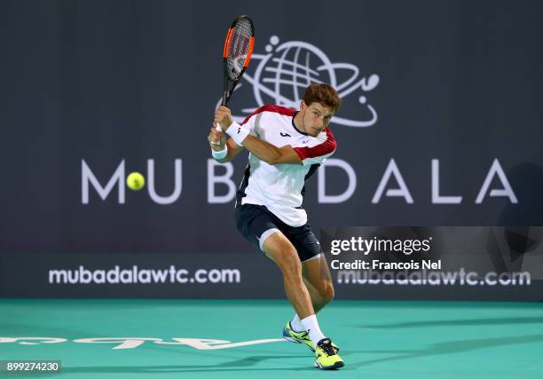 Pablo Carreno Busta of Spain in action against Kevin Anderson of South Africa during his men's singles match on day one of the Mubadala World Tennis...