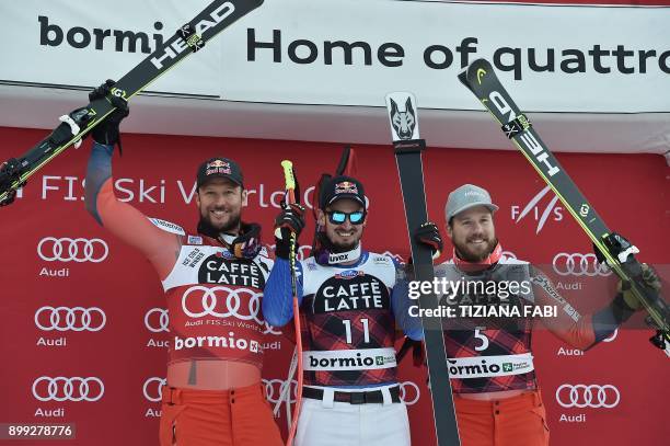 Winner Italy's Dominik Paris , second-placed Norway's Aksel Lund Svindal and third-placed Norway's Kjetil Jansrud , celebrate on the podium after the...