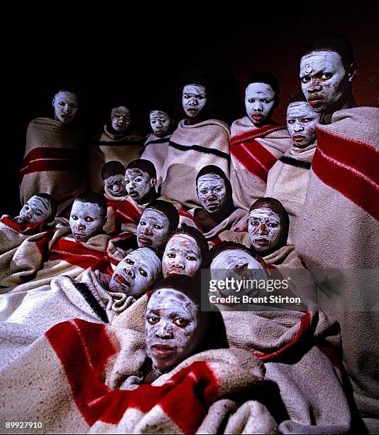 Group of recently circumcised boys from the Xhosa tribe are seen together in a traditional hut on October 8, 2003 in rural Transkei, South Africa....