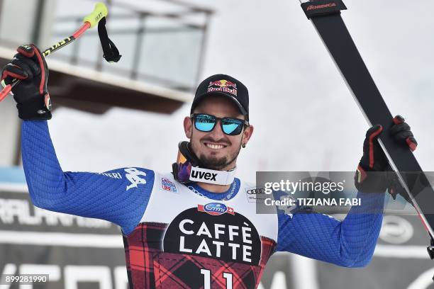 Italy's Dominik Paris celebrates after winning the FIS Alpine World Cup Men Downhill in Bormio, Italian Alps on December 28, 2017. / AFP PHOTO /...