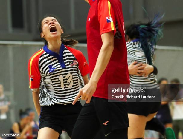 Markham, ON - OCTOBER, 20 Malaysian player, Kwei Xian Chong screams as her team wins in overtime. In a women's semi-final, Malaysia beat the USA in...