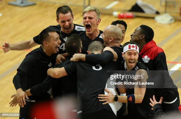 Markham, ON - OCTOBER, 20 Canadian men celebrate their victory over the USA. In a men's semi-final, Canada beat the USA 10-9 in overtime and will go...