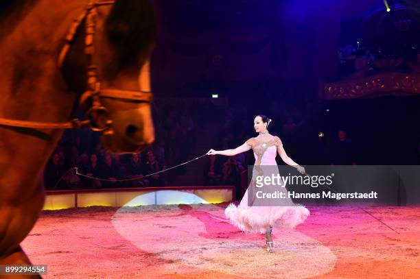 Jana Lacey-Krone performs with her horses during Circus Krone celebrates premiere of 'In Memoriam' at Circus Krone on December 25, 2017 in Munich,...