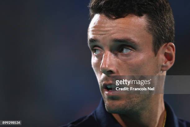 Roberto Bautista Agut of Spain looks on against Andrey Rublev of Russia during his men's singles match on day one of the Mubadala World Tennis...