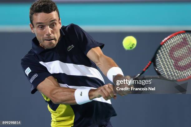 Roberto Bautista Agut of Spain in action against Andrey Rublev of Russia during his men's singles match on day one of the Mubadala World Tennis...