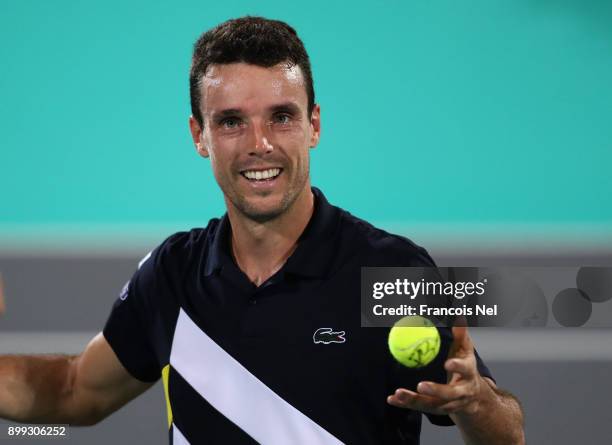 Roberto Bautista Agut of Spain celebrates victory against Andrey Rublev of Russia during his men's singles match on day one of the Mubadala World...