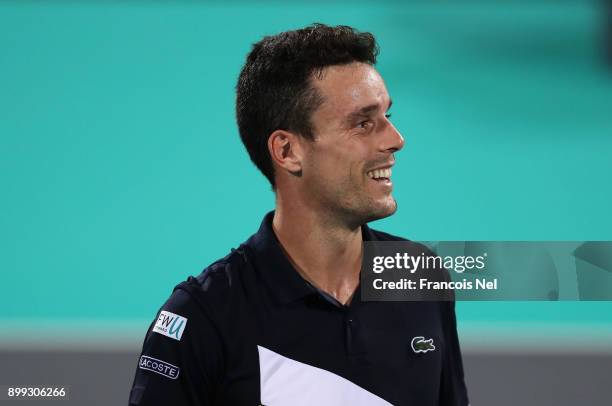 Roberto Bautista Agut of Spain celebrates victory against Andrey Rublev of Russia during his men's singles match on day one of the Mubadala World...
