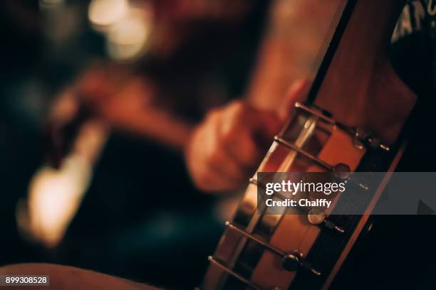 musicians on a stage - banjo stock pictures, royalty-free photos & images