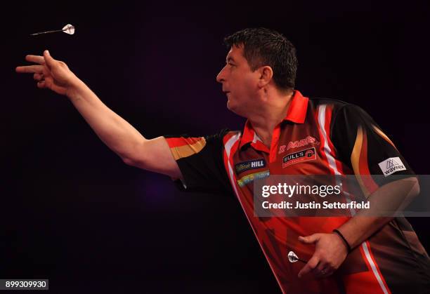 Mensur Suljovic in action during his Third Round Match against Dimitri Van Den Bergh during the 2018 William Hill PDC World Darts Championships on...