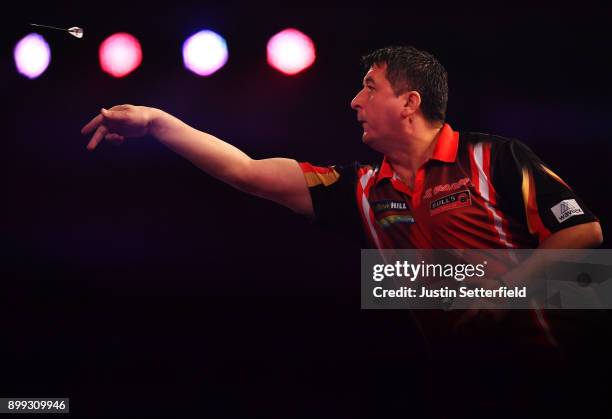 Mensur Suljovic in action during his Third Round Match against Dimitri Van Den Bergh during the 2018 William Hill PDC World Darts Championships on...