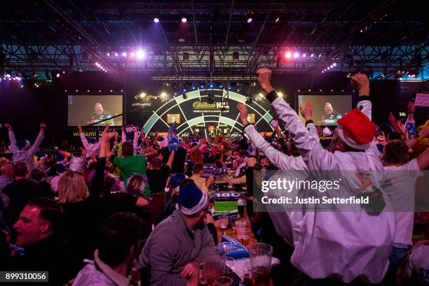 John Henderson in action during his Third Round Match against Rob Cross during the 2018 William Hill PDC World Darts Championships on Day Twelve at...