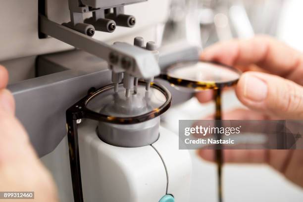 ophthalmology medical instrument measuring glass on eyewear - optometria imagens e fotografias de stock