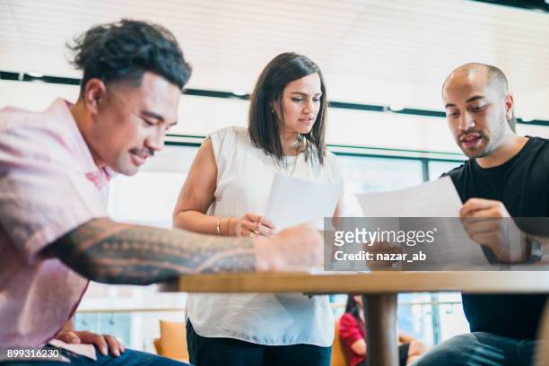 discussing the new strategy. - māori stock pictures, royalty-free photos & images