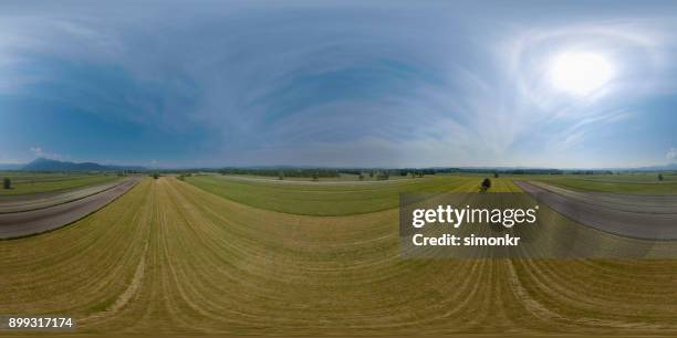 empty road with grassy landscape - vr 360 stock pictures, royalty-free photos & images