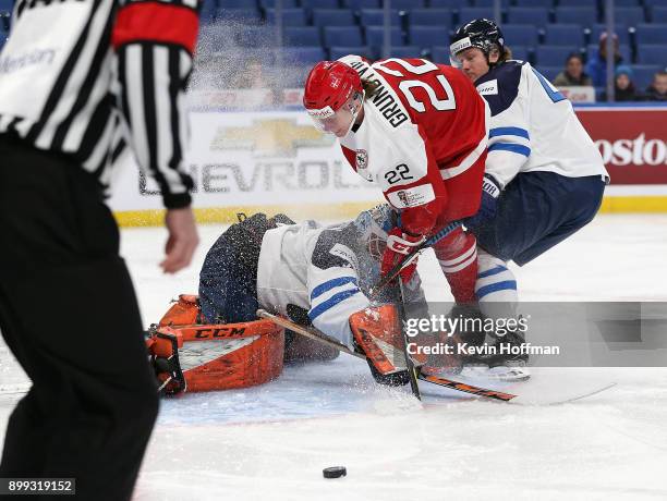 Ukko-Pekka Luukkonen of Finland makes the save against Andreas Grundtvig of Denmark in the first period during the IIHF World Junior Championship at...