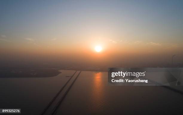 taicang chemical oil tanker pier in the sunset,jiangsu,china - petrolium fotografías e imágenes de stock