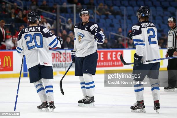 Juuso Valimaki of Finland celebrates after scoring on Denmark with Eeli Tolvanen and Miro Heiskanen in the second period during the IIHF World Junior...