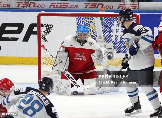 Kasper Krog of Denmark makes the save on a shot by Henri Jokiharju of Finland in the third period during the IIHF World Junior Championship at...
