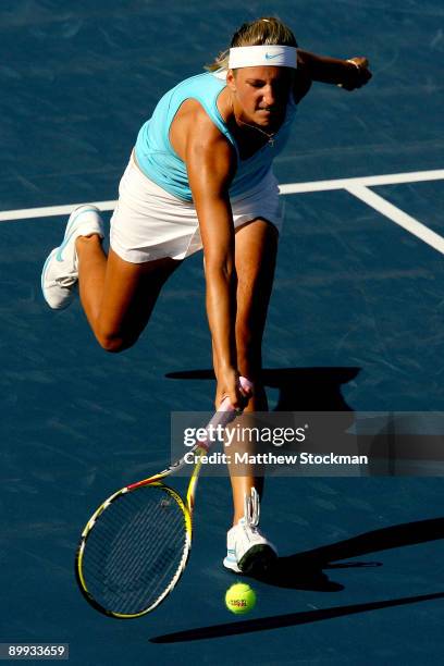 Victoria Azarenka of Belarus returns a shot against Kim Clijsters of Belgium during the Rogers Cup at the Rexall Center on August 19, in Toronto,...