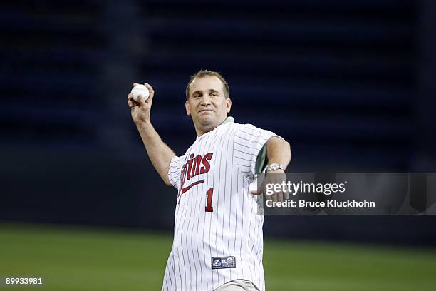 Minnesota Wild head coach Todd Richards throws out a ceremonial first pitch before the game between the Minnesota Twins and the Kansas City Royals on...