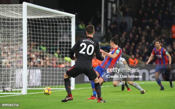 Shkodran Mustafi of Arsenal scores their first goal during the Premier League match between Crystal Palace and Arsenal at Selhurst Park on December...