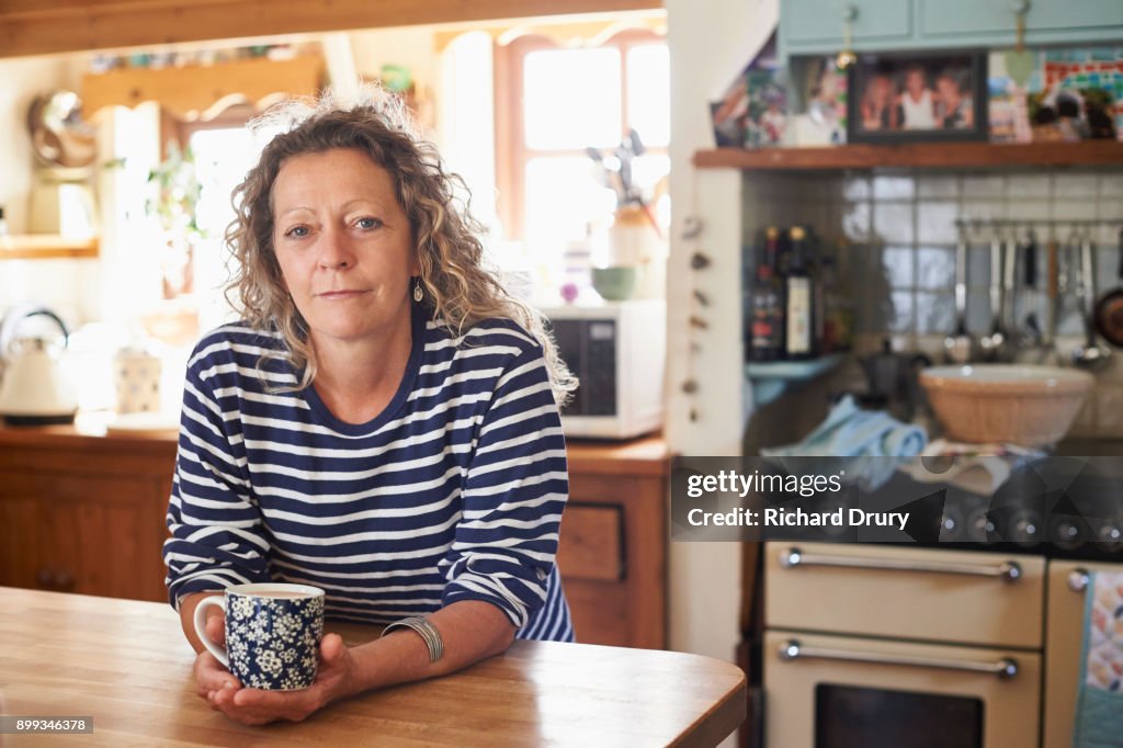 Woman holding mug of tea