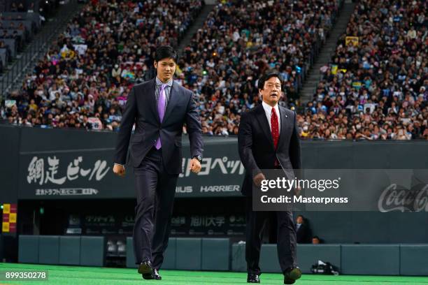 Shohei Ohtani of the Los Angeles Angels and Hokkaido Nippon Ham Fighters head coach Hideki Kuriyama attend the farewell event at Sapporo Dome on...