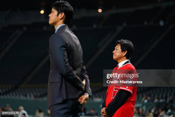 Shohei Ohtani of the Los Angeles Angels attends his farewell event with Hokkaido Nippon Ham Fighters head coach Hideki Kuriyama at Sapporo Dome on...