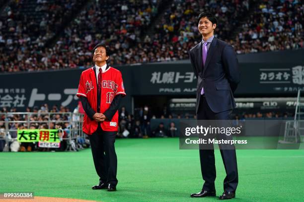 Shohei Ohtani of the Los Angeles Angels attends his farewell event with Hokkaido Nippon Ham Fighters head coach Hideki Kuriyama at Sapporo Dome on...