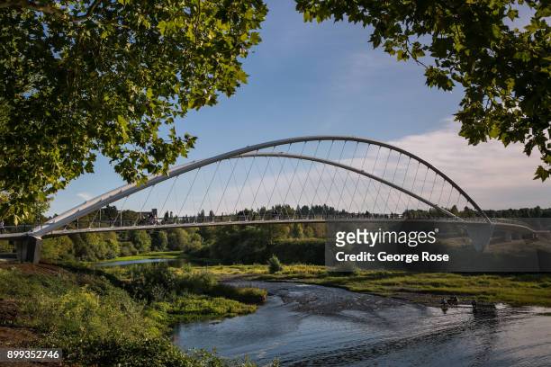 The Peter Courtney Minto Island bike and pedestrian bridge over the Willamette River is viewed on September 27 in Salem, Oregon. Dundee, Carlton,...