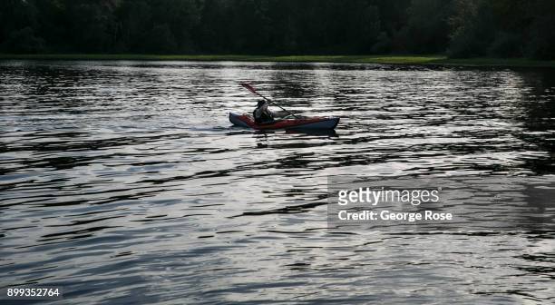 Canoe on the Willamette River at Riverfront Park is viewed on September 27 in Salem, Oregon. Dundee, Carlton, McMinnville, and Newburg, all small...