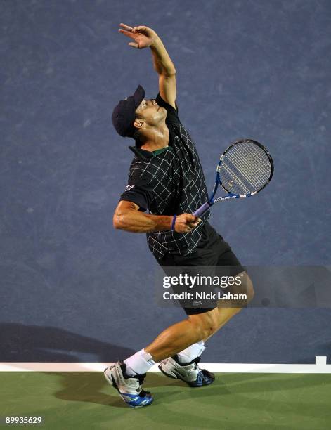 Andy Roddick serves to Sam Querrey during day three of the Western & Southern Financial Group Masters on August 19, 2009 at the Lindner Family Tennis...