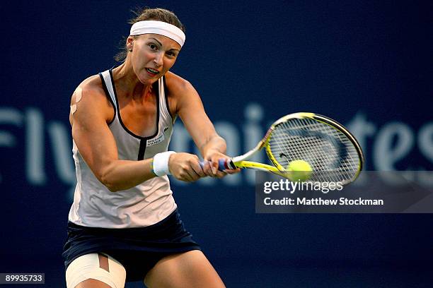 Yaroslava Shvedova of Kazakistan returns a shot to Serena Williams of the U.S. During the Rogers Cup at the Rexall Center on August 19, in Toronto,...