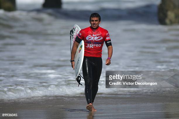 Dylan Melamed walks up the beach after Heat 6 of the Round of 64 of the Nike 6.0 Pro Junior Men's Grade 2 event as part of the 2009 Hurley U.S. Open...