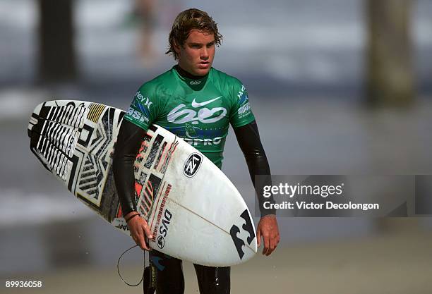 Granger Larsen USA) walks up the beach after Heat 5 of the Round of 64 of the Nike 6.0 Pro Junior Men's Grade 2 event as part of the 2009 Hurley U.S....