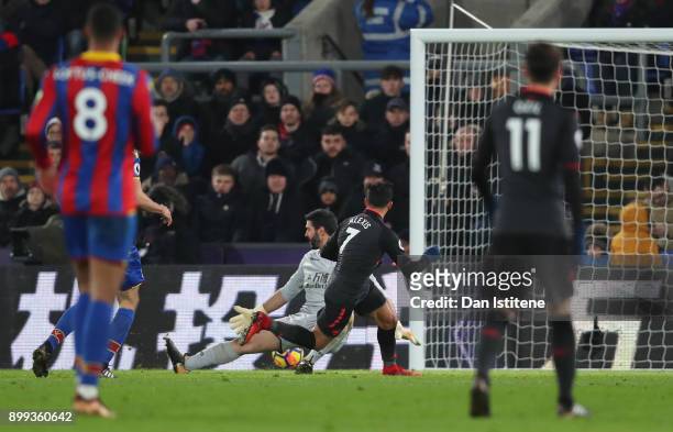 Alexis Sanchez of Arsenal scores their third goal past Julian Speroni of Crystal Palace during the Premier League match between Crystal Palace and...