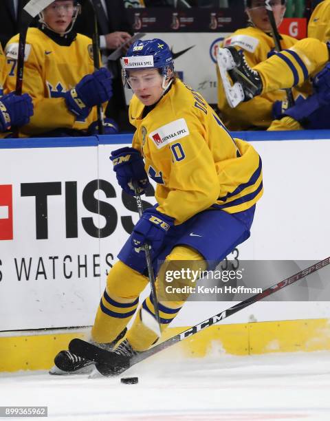 Marcus Davidsson of Sweden skates up ice with the puck in the first period against Czech Republic during the IIHF World Junior Championship at...