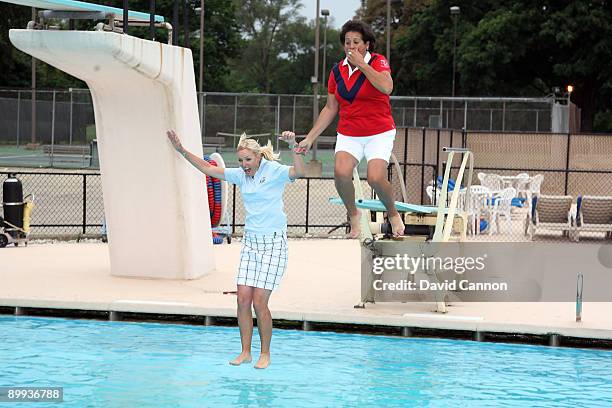 Nancy Lopez the Captain of the USA team and Carin Koch of Sweden the Captain of the European Team enjoy a cool off in the swimming pool with team...