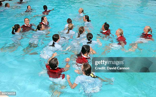 Players from both teams in the pool after the matches had finished during the final day of the 2009 Junior Solheim Cup Matches, at the Aurora Country...