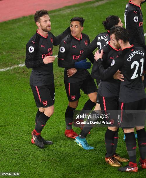 Shkodran Mustafi celebrates scoring a goal for Arsenal with Alexis Sanchez during the Premier League match between Crystal Palace and Arsenal at...