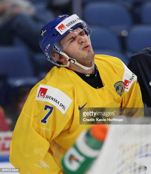 Timothy Liljegren of Sweden is shaken up in the second period against Czech Republic during the IIHF World Junior Championship at KeyBank Center on...