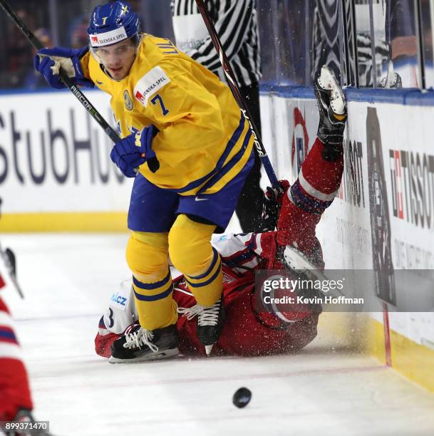 Timothy Liljegren of Sweden checks Martin Necas of Czech Republic in the second period during the IIHF World Junior Championship at KeyBank Center on...