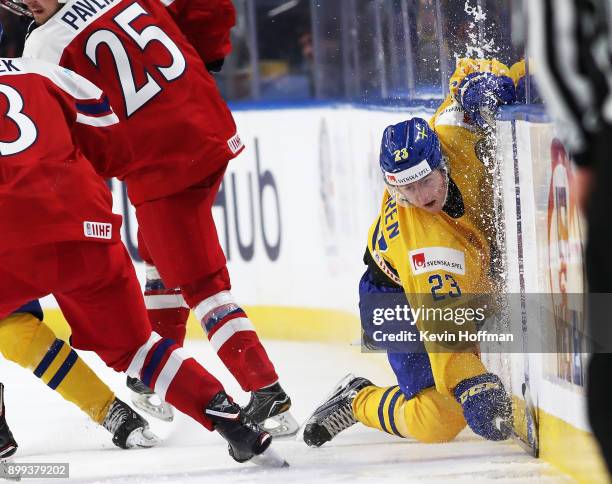 Jesper Sellgren of Sweden misses a check against Czech Republic in the third period during the IIHF World Junior Championship at KeyBank Center on...